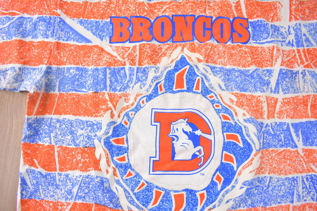 Vintage 1990s Denver Broncos NFL Football All Over Print Graphic T-Shirt Made In USA