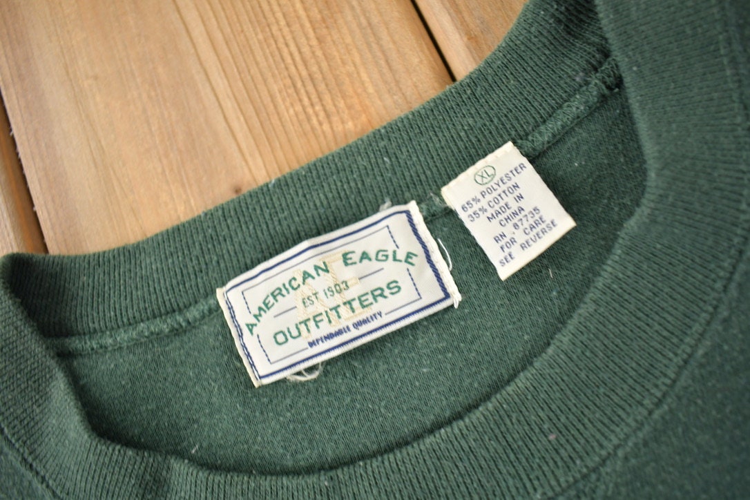 Vintage 1990s American Eagle Outfitters Fish Graphic Outdoorsman Crewneck Sweatshirt Size XL