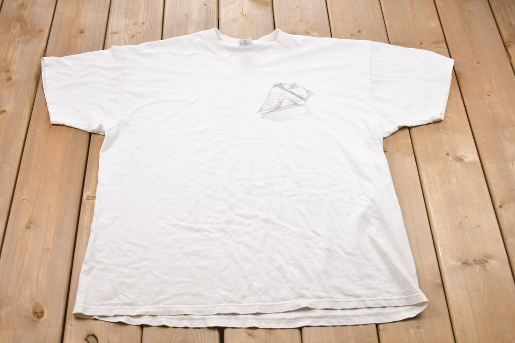 Vintage 1993 Jesus Loves Us Graphic T-Shirt