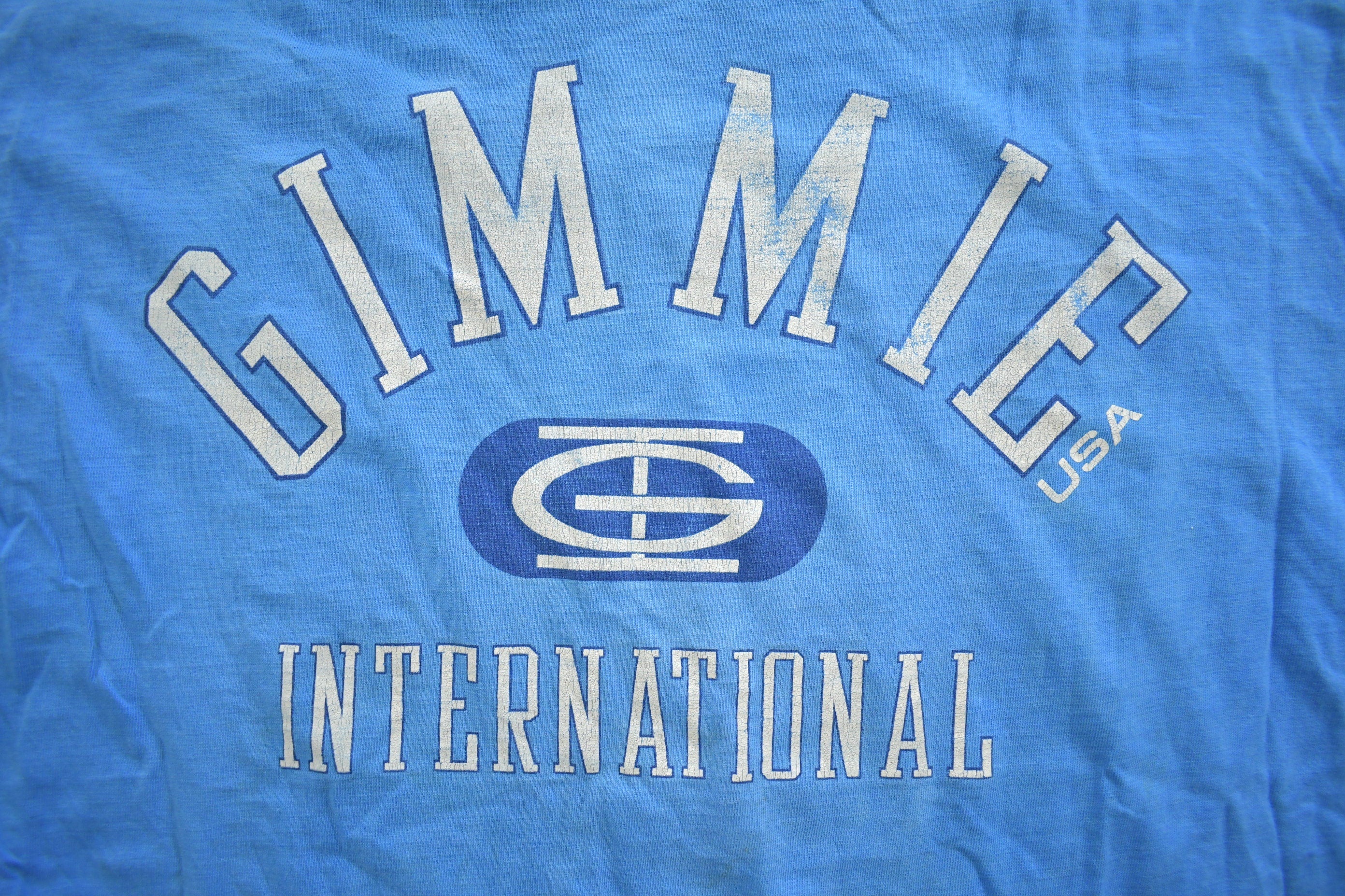 Vintage 1990s Gimmie International Graphic T Shirt Made In USA