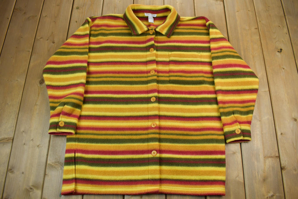 A multicolored striped button up coat featuring a variety of colors including red, yellow, green, and orange.