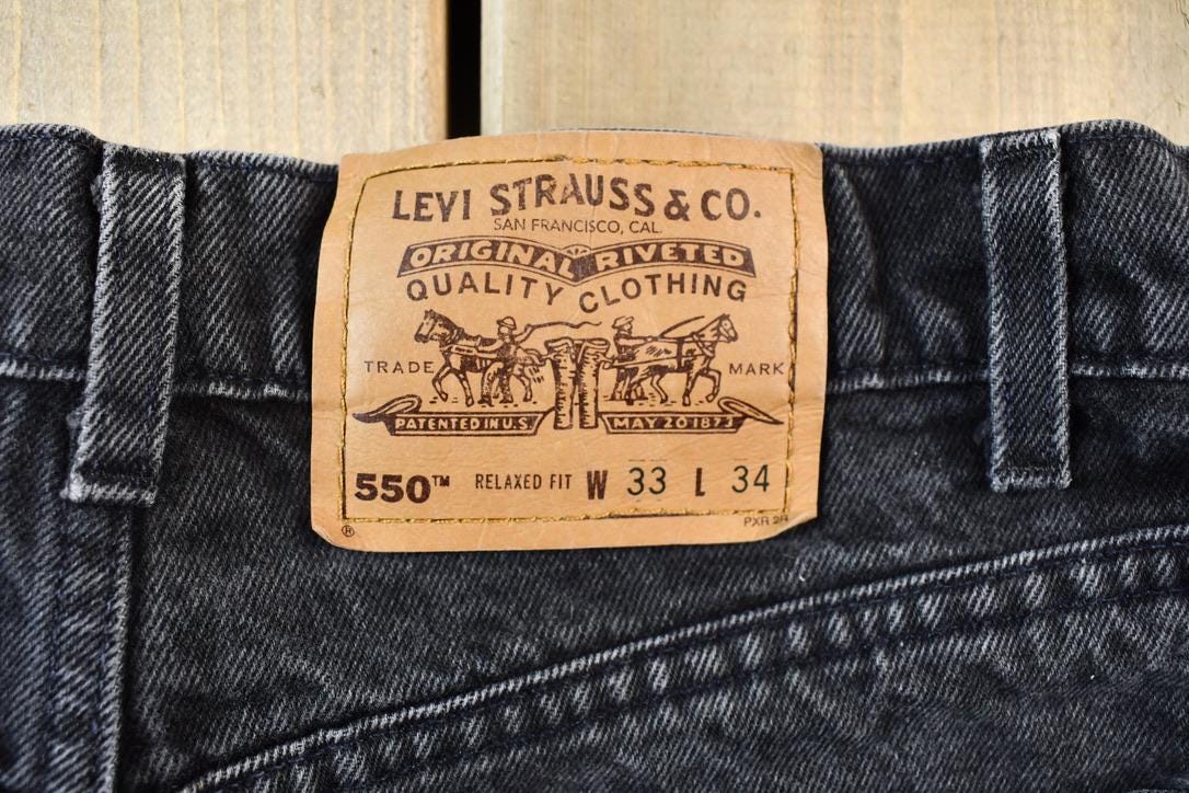 Vintage 1990s Orange Tab Levis 550 Denim Jeans Size 32 x 32