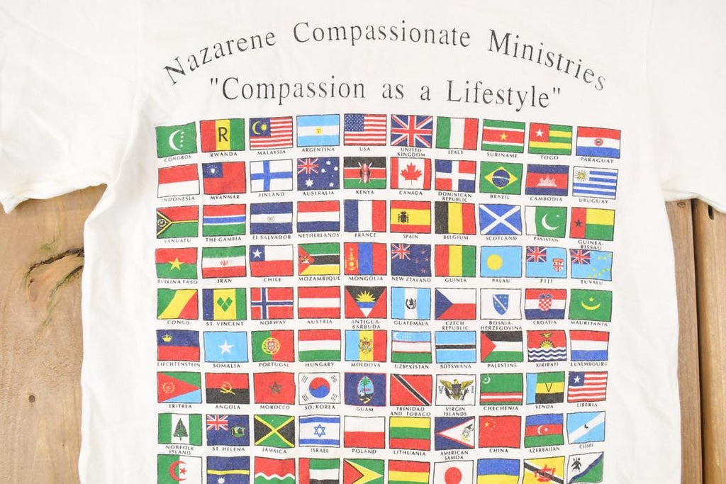 Vintage 1990s Compassion As A Lifestyle Souvenir Multi Flag FAB T-Shirt Men's S