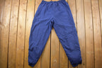 Vintage 1990s Blue Nike Mini Swoosh Windbreaker Pants Size XL