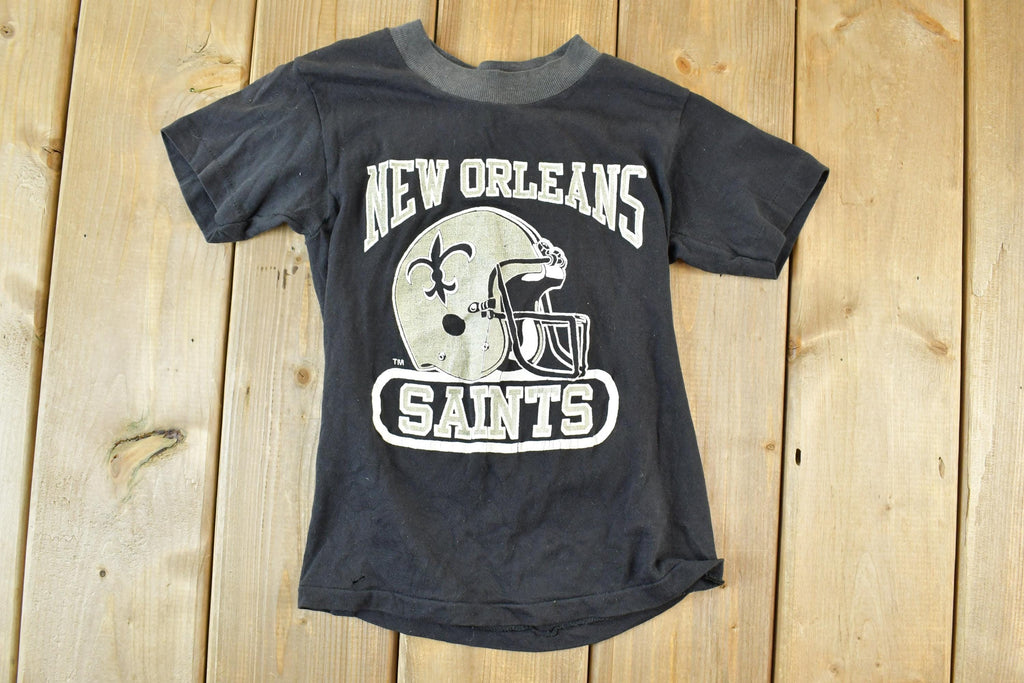 Vintage 1990s Logo 7 New Orleans Saints Youth NFL Graphic T-Shirt