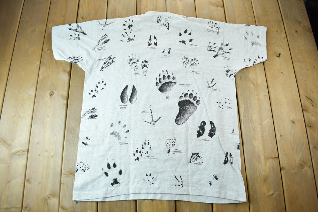 Vintage 1990s Animal Tracks All Over Print Graphic T-Shirt