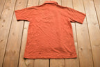 Vintage 1990s Grand Slam Munsingwear Button Up Collar Pocket T-Shirt