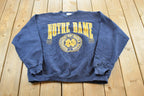 Vintage 1990s Notre Dame University Fighting Irish Thrashed Crewneck Sweatshirt Men's 2XL / NCAA College Spellout Sweater / Made in USA