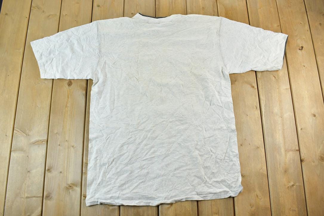 Vintage 1990s Colorado Buffalo Bills Double Sleeve Outdoors T-Shirt