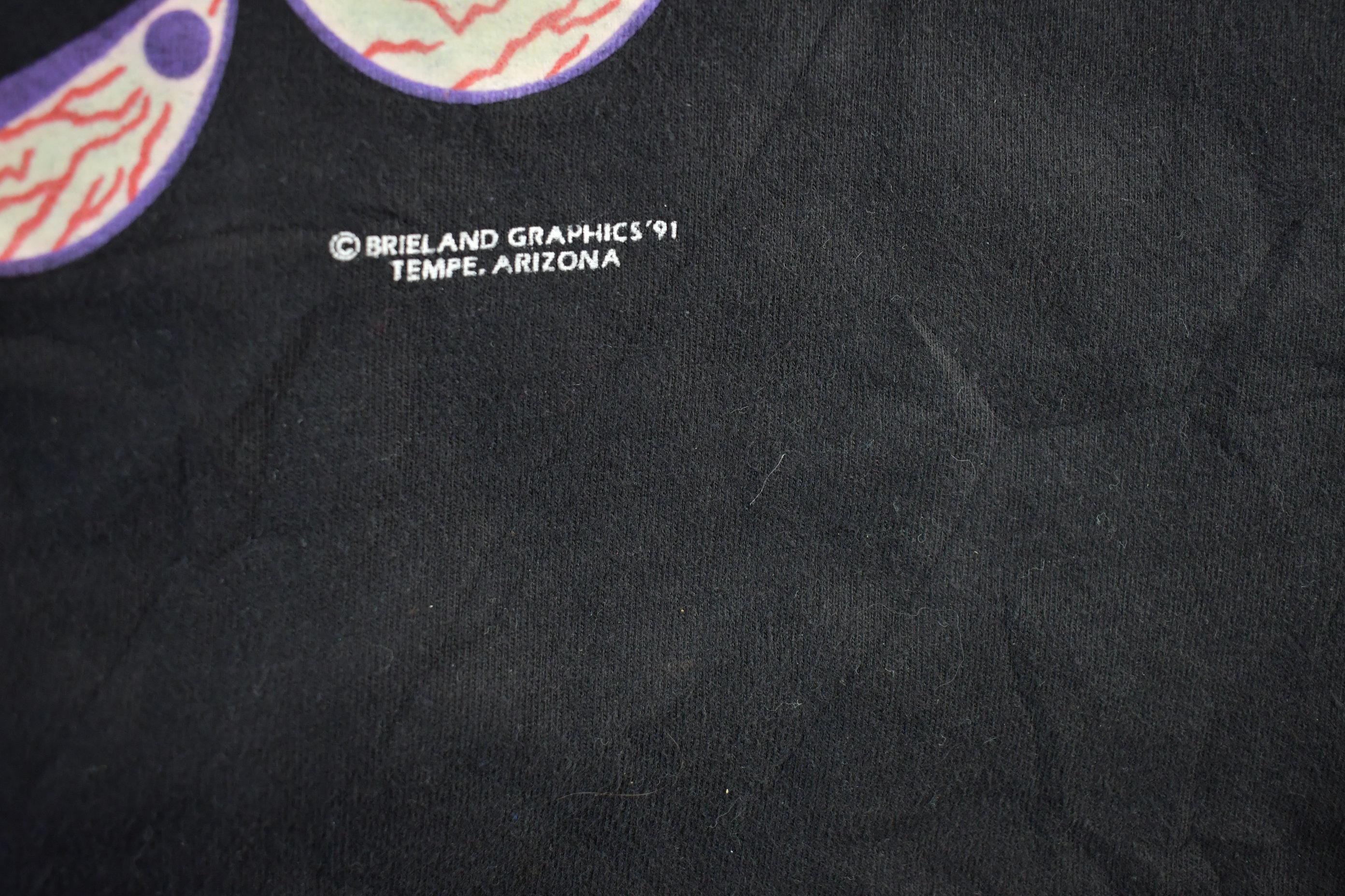 Vintage 1990s Brieland Graphics Glow In The Dark Eyes T-Shirt Men's Large