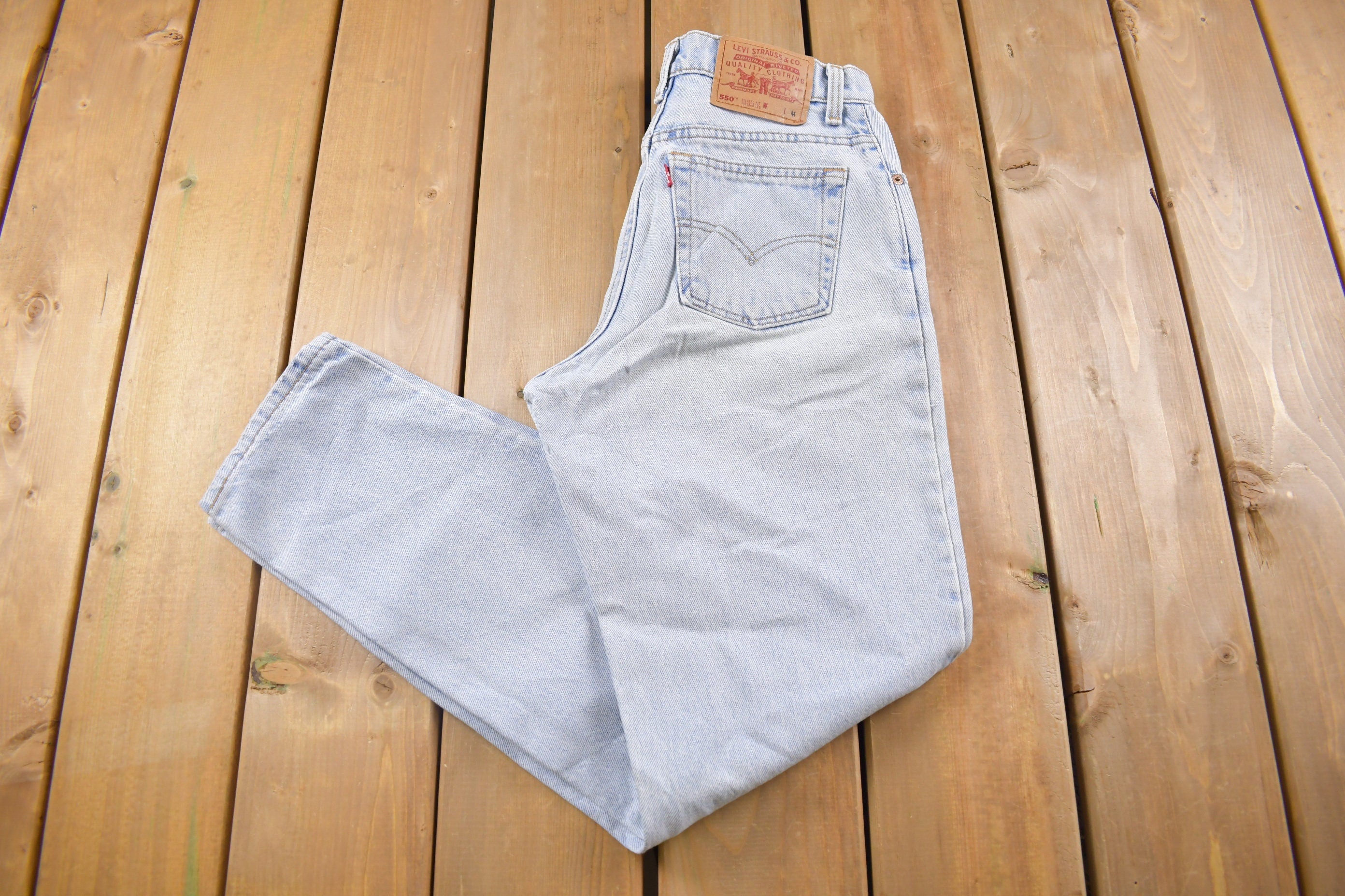 Vintage 1990s Levi's 550 Red Tab Jeans Size 26 x 30