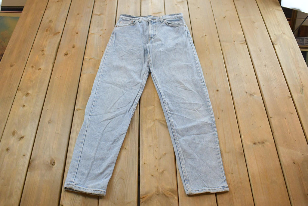 Vintage 1990s Levi's 550 Relaxed Tapered Denim Jeans Women's 28 x 31 / 90s Levi's / Distressed Sun Faded Jeans / Streetwear / Made in USA