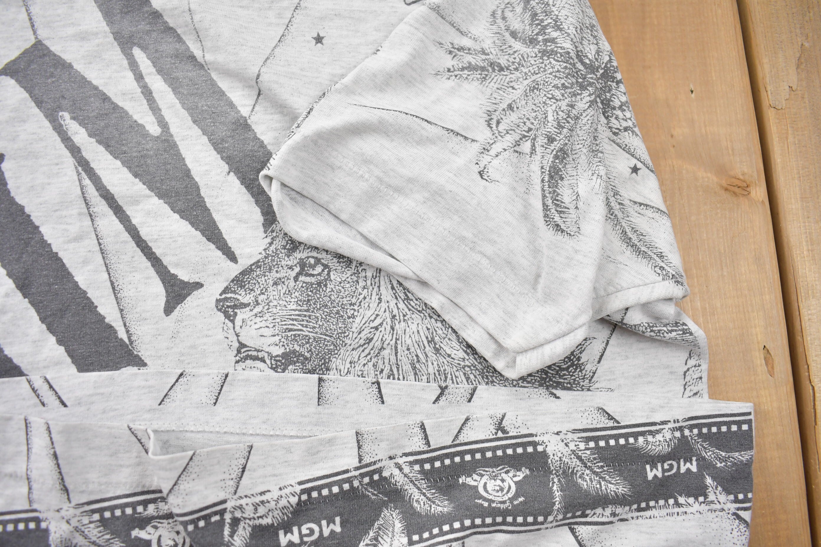 Vintage 1990s Metro Goldwyn Mayer Graphic All Over Print T Shirt