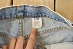 Vintage 1990s Levi's 505 Regular Straight Fit Denim Jeans Men's 33 x 29 / 90s Levi's / Distressed Sun Faded Jeans