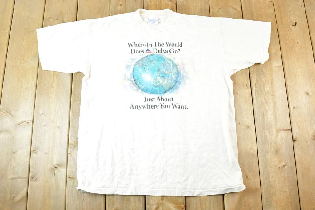 Vintage 1990s Where In The World Does Delta Go Souvenir T-Shirt Men's L