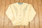Vintage 1990s Northern Reflections Floral Graphic Print Button Up Double Collar Crewneck Sweatshirt Womens L