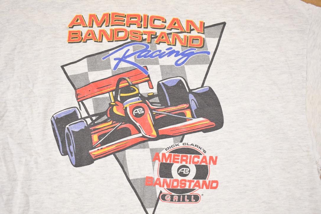 Vintage 1990s American Bandstand Racing Cartoon Graphic Print Souvenir F1 T-Shirt Men's L / Made In USA / Rare Vacation Destination Tee