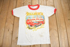 Vintage 1980s The Elliots A Family Tradition Graphic Ringer T Shirt