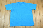 Vintage 1990s Blank Sky Blue Souvenir Single Stitch Graphic Print T-Shirt /