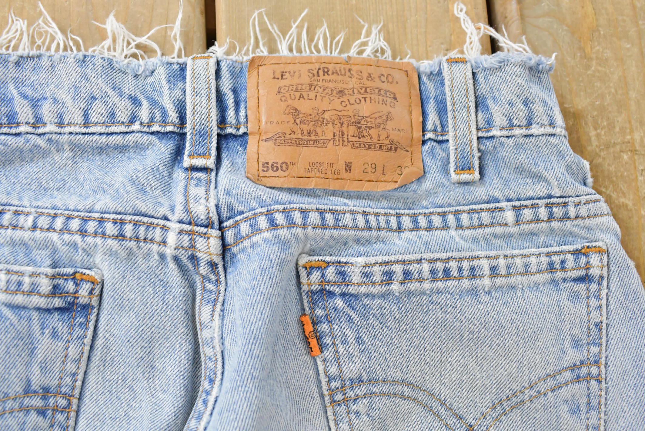 Vintage 1990s Levi's 560 Loose Tapered Denim Jeans Men's 26 x 31 / 90s Levi's / Distressed Sun Faded Jeans