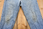 Vintage 1990s Distressed Levi's 550 Light Wash Jeans