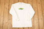 Vintage 1990s Reach Water Ski Cartoon Logo Graphic Print Long Sleeve T Shirt Mens M