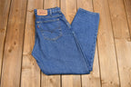 Vintage 1990s Levi's 560 Medium Wash Loose Fit Tapered Leg Mom Jeans