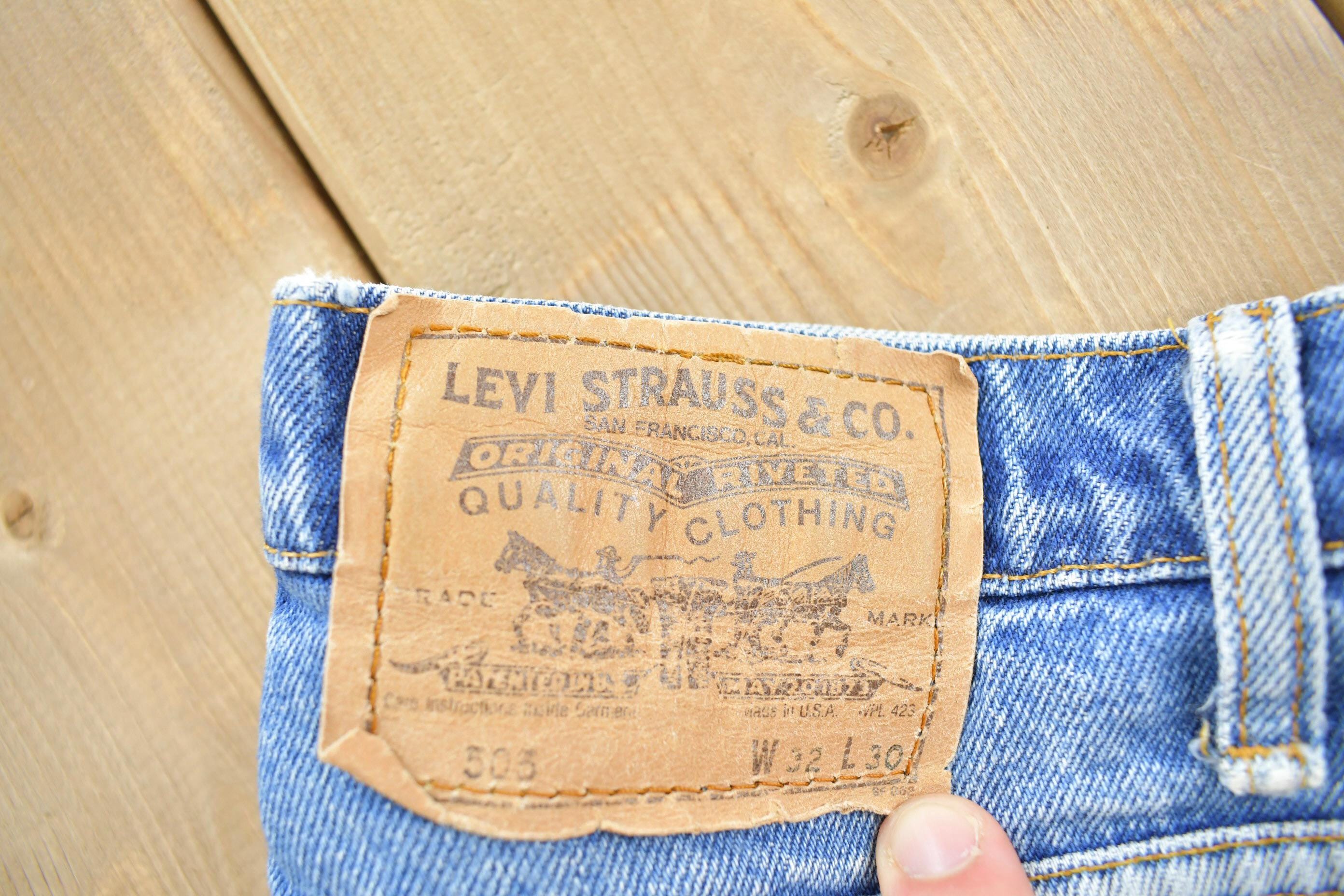 Vintage 1990s Levi's 550 Orange Tab Jeans Size 32x30