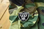 Vintage 1990s Camo Raiders NFL Football Hooded Puffer Jacket