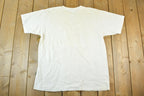 Vintage 1990s Dilbert Our Two Goals This Year Souvenir T-Shirt Mens L