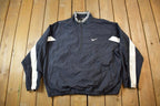 Vintage 1990s Nike Red Tab Back Spellout Windbreaker Jacket - XXL