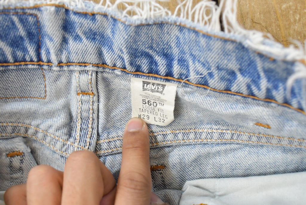 Vintage 1990s Levi's 560 Loose Tapered Denim Jeans Men's 26 x 31 / 90s Levi's / Distressed Sun Faded Jeans