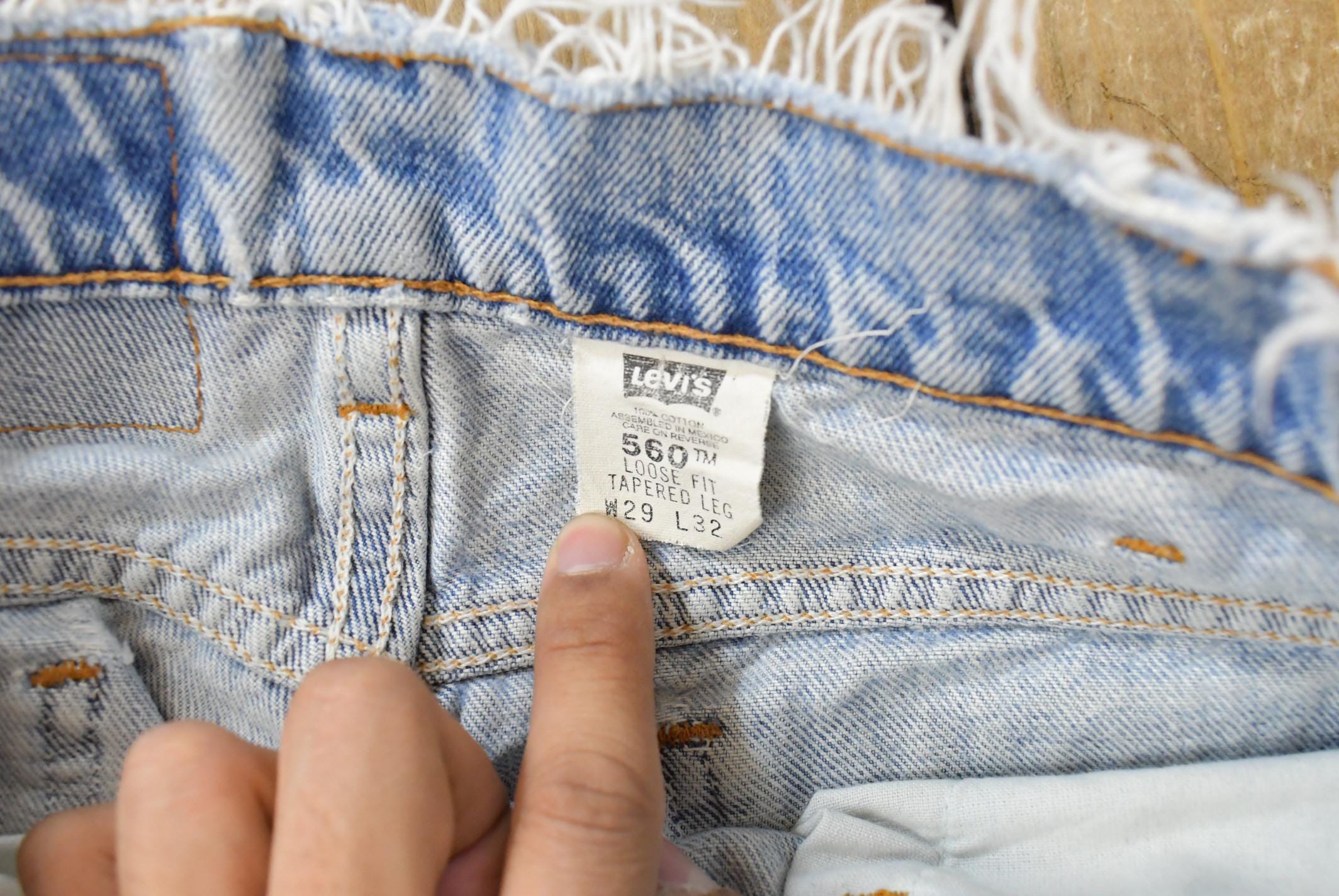 Vintage 1990s Levi's 560 Loose Tapered Denim Jeans Men's 26 x 31 / 90s Levi's / Distressed Sun Faded Jeans