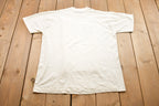 Vintage 1990s Screen Stars Best The Swiss Colony Graphic T-Shirt