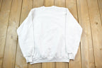 Vintage 1986 Squiggle Hair Guy Story Print Crewneck Sweatshirt