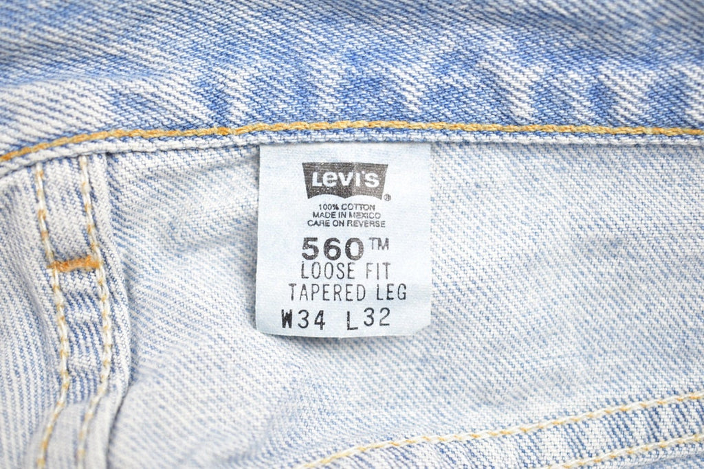 Vintage 1990s Levi 560 Red Tab Jeans Size 35 x 28