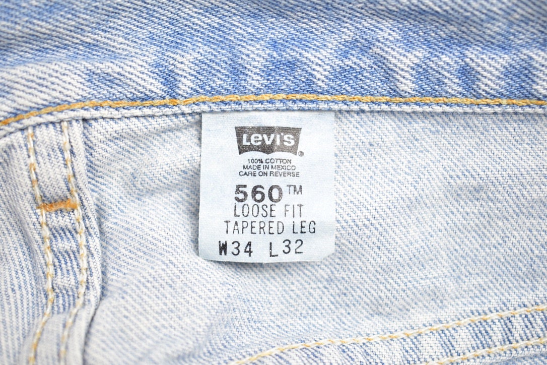 Vintage 1990s Levi 560 Red Tab Jeans Size 35 x 28