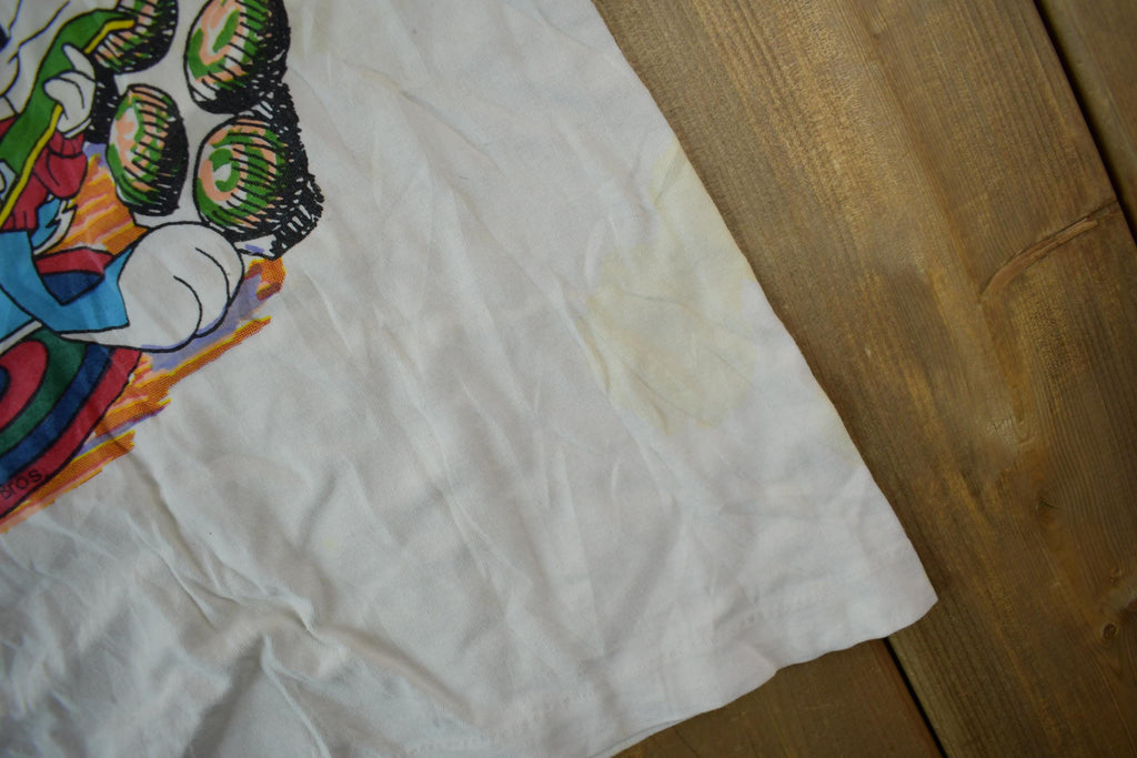 Vintage 1990s Tiny Tunes Destination Alps All Over Print Graphic T-Shirt  Warner Bros  Looney Tunes  3XL  CUT NECK