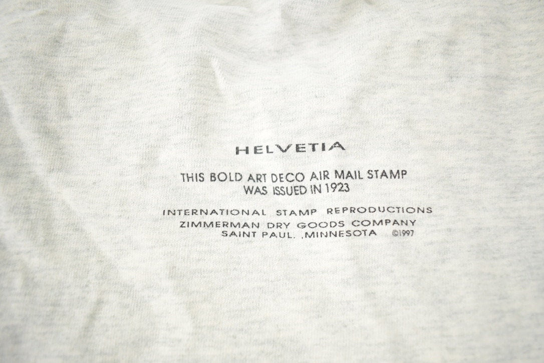 Vintage 1997 Helvetia Bold Art Deco Air Mail Stamp Graphic T Shirt Made In USA