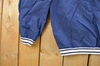Vintage 1990s Nike Embroidered Mini Swoosh Pullover Windbreaker Men's XL