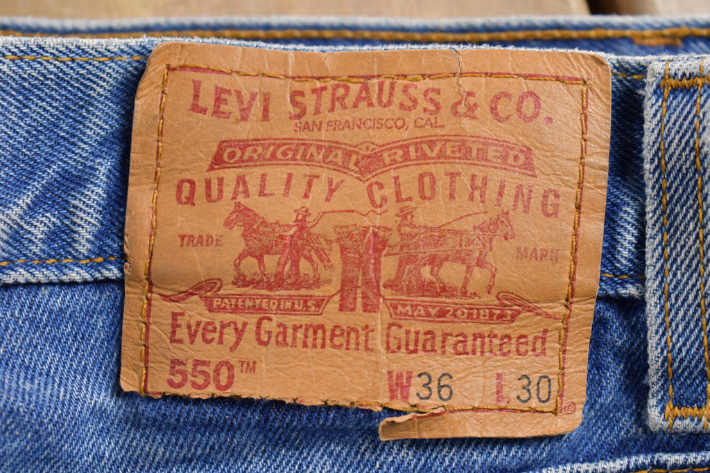 Vintage 1990s Levi's 550 Red Tab Jeans Size 36 x 29.5 / Blue / Denim / Made In USA / 90s Levi's / Tapered Fit / Distressed