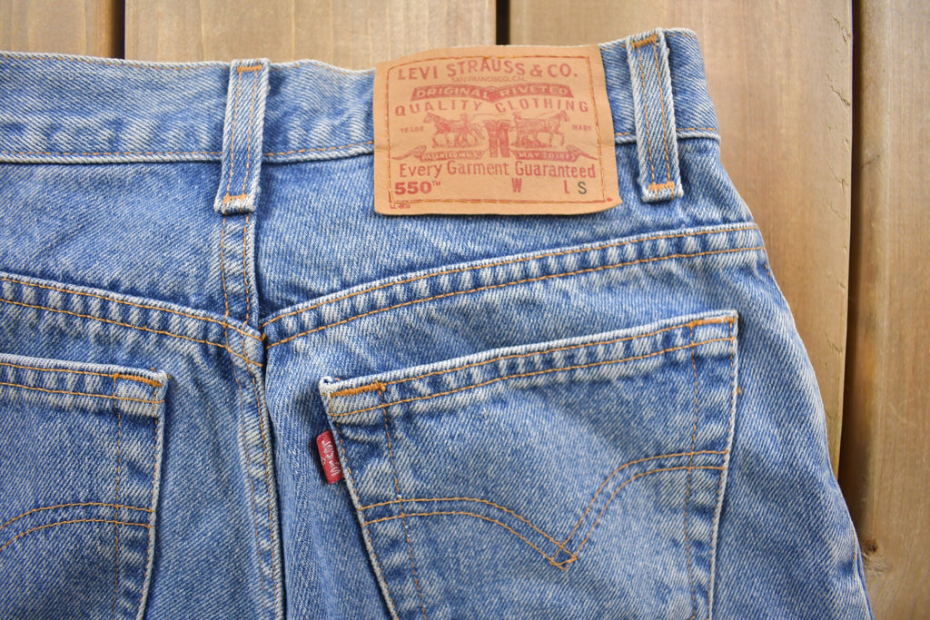 Vintage 1990s Levi's 550 Red Tab Denim Jeans Size 26 x 28