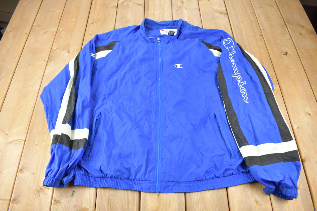 Vintage 1990s Champion Embroidered Spell Out Windbreaker