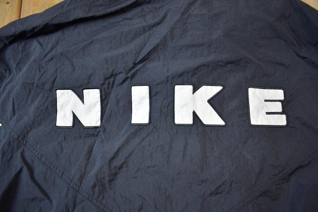 Vintage 1990s Nike Red Tab Back Spellout Windbreaker Jacket - XXL