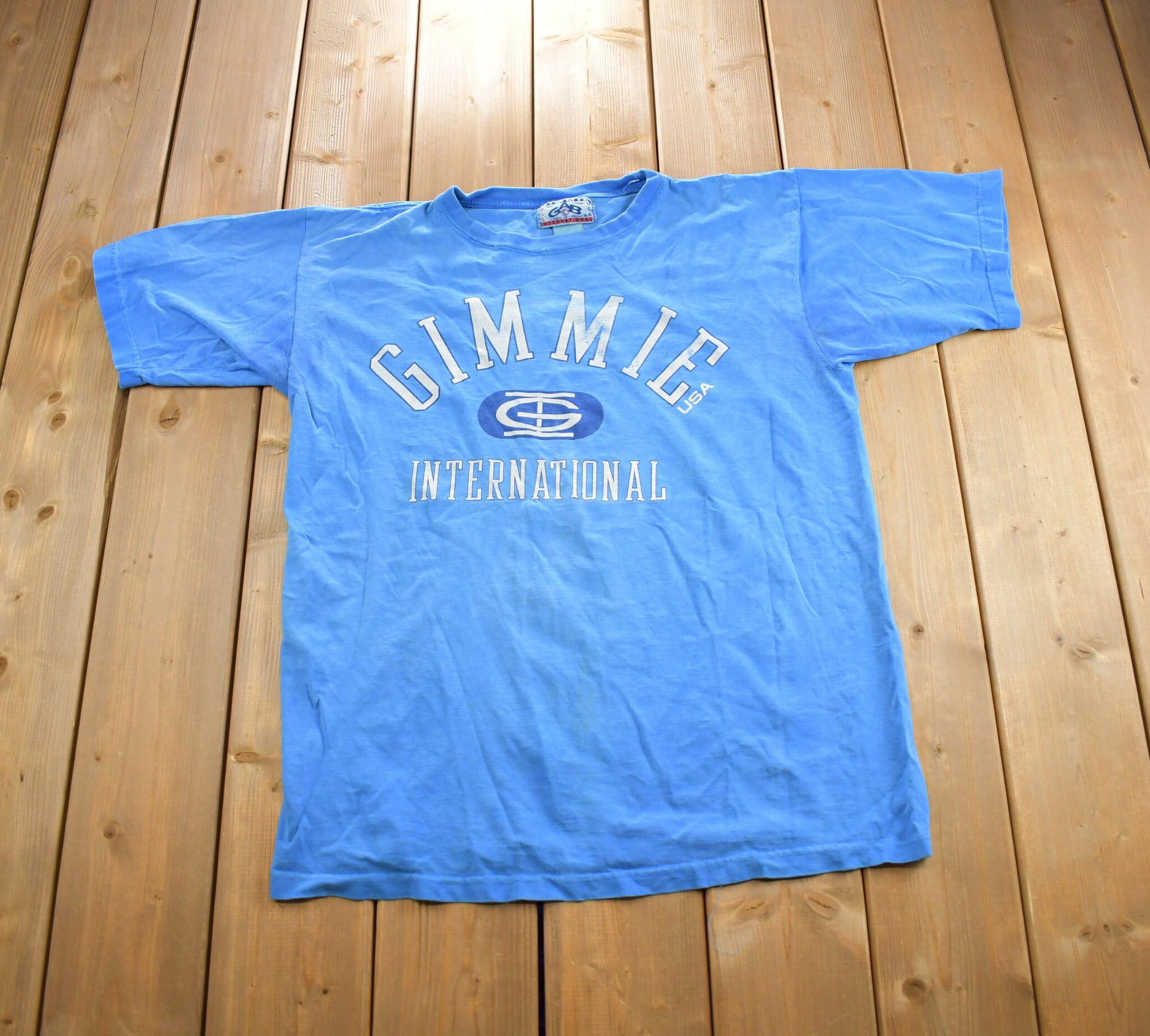 Vintage 1990s Gimmie International Graphic T Shirt Made In USA