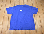 Vintage 2000s White Swoosh Blue Nike Graphic T-Shirt Size XL