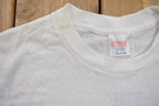 Vintage 1980s CPC Survivor Hugger Graphic T Shirt