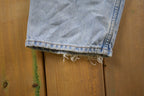 Vintage 1990s Levi's 550 Red Tab Ripped Denim Jeans Size 32 x 31
