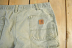 Vintage 1990s Carhartt Distressed Sun Faded Denim Work Jeans Adult 37 x 30