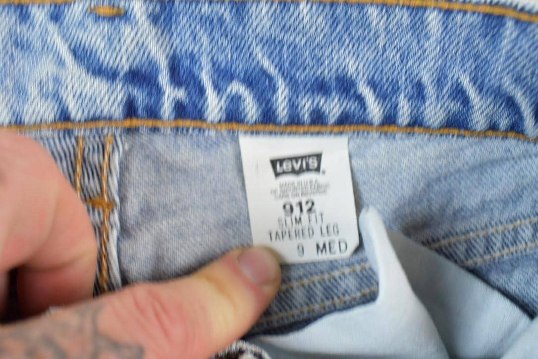 Vintage 1990s Levi Strauss 912 Orange Tab Slim Fit Tapered Leg Denim Jeans Size 28 x 28